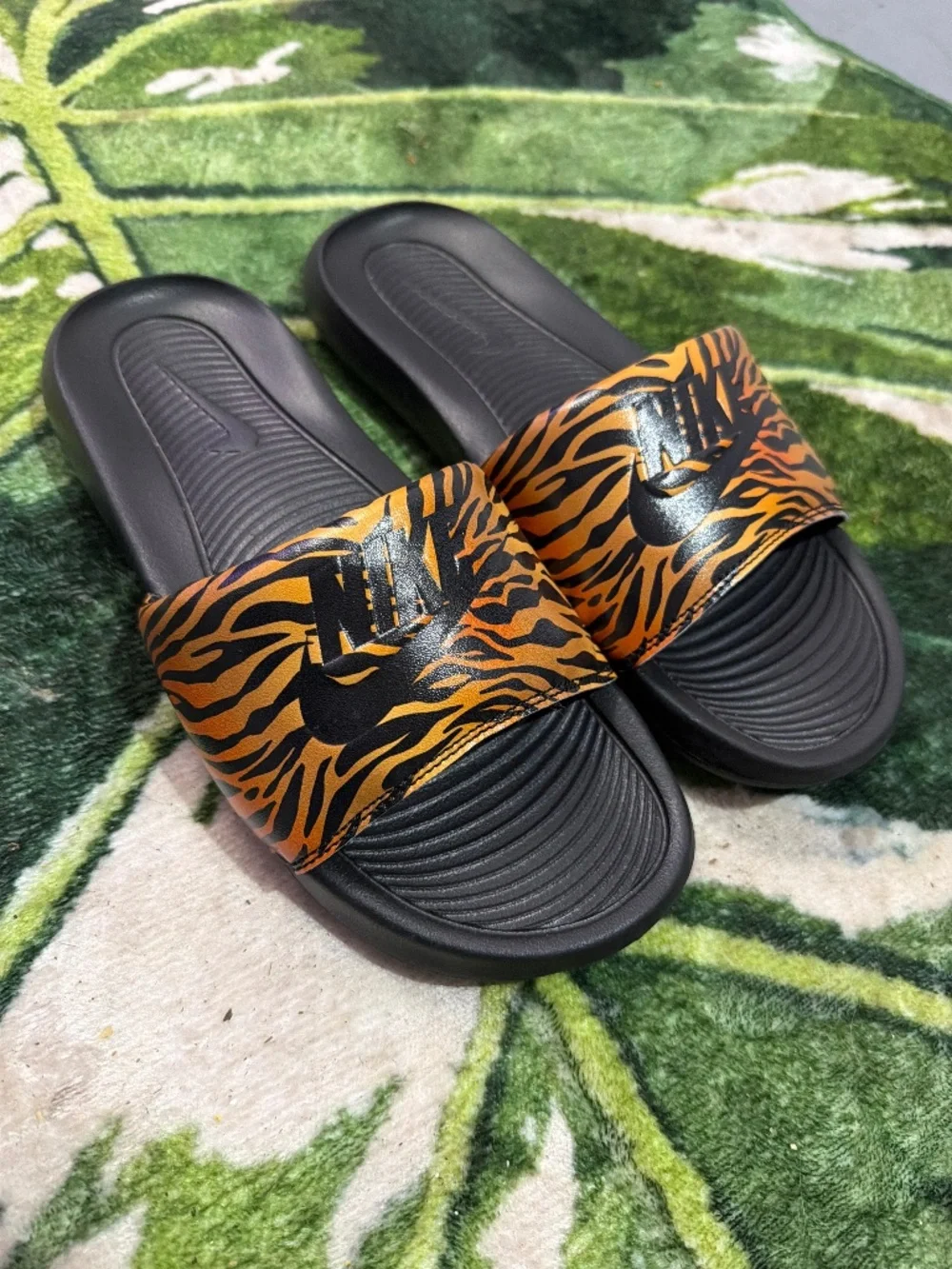 Nike Women's Black Slides with Orange Tiger-Print Strap